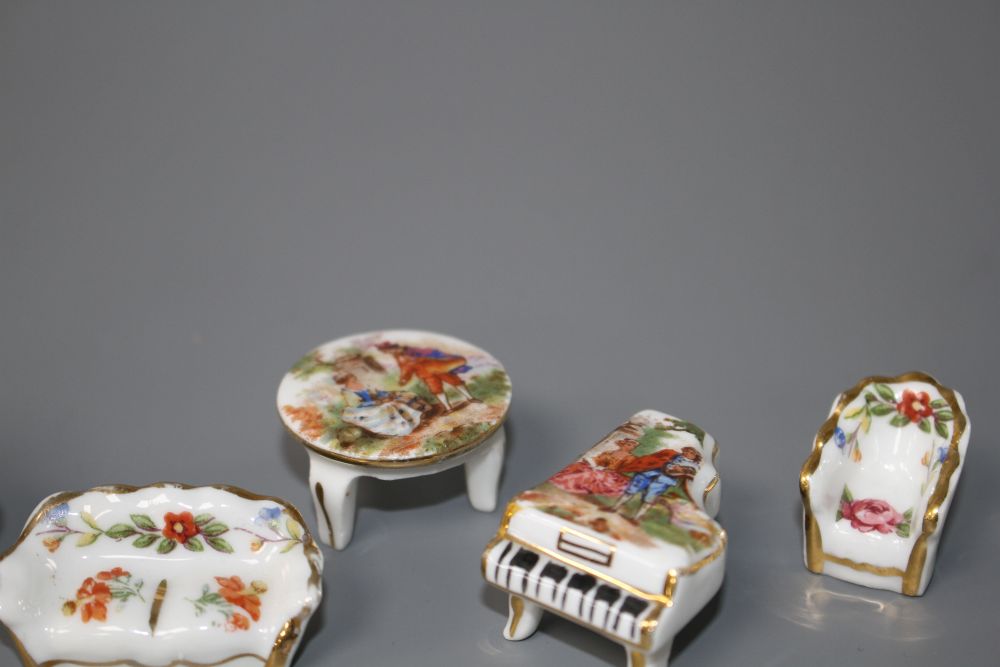 An eight piece Limoges porcelain miniature salon suite and a similar basket, 4.5cm